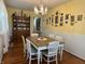Traditional dining room with hardwood floors, wainscoting, and antique china cabinet at 4106 N Sherman Dr, Indianapolis, IN 46226