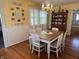 Bright dining area featuring hardwood floors and decorative antique china cabinet at 4106 N Sherman Dr, Indianapolis, IN 46226