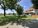 Home has lush lawn and mature trees with nice landscaping at 4106 N Sherman Dr, Indianapolis, IN 46226