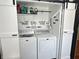 Convenient laundry closet with washer, dryer, and ample shelving at 4106 N Sherman Dr, Indianapolis, IN 46226