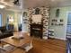 Open living room with a decorative fireplace and large windows, offering a cozy and bright space for relaxation at 4106 N Sherman Dr, Indianapolis, IN 46226