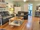 Inviting living room featuring hardwood floors, comfortable seating, and natural light, creating a warm atmosphere at 4106 N Sherman Dr, Indianapolis, IN 46226