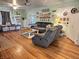 Bright living room with wood floors, comfortable seating, and decorative shelving at 4106 N Sherman Dr, Indianapolis, IN 46226