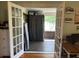 Bright sunroom featuring double doors, natural light, and outdoor view at 4106 N Sherman Dr, Indianapolis, IN 46226