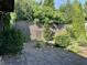 Backyard featuring lush landscaping, stone pavers, and a wooden fence for privacy at 474 N Kristi Rd, Martinsville, IN 46151