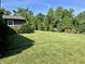 Spacious backyard featuring lush grass and mature trees at 474 N Kristi Rd, Martinsville, IN 46151