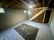 Spacious unfinished basement with exposed ceiling, brick accents, and a cozy carpet at 474 N Kristi Rd, Martinsville, IN 46151