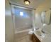 A full bathroom with a tiled shower-tub combo and a single-sink vanity providing space and functionality at 474 N Kristi Rd, Martinsville, IN 46151