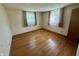 Bright bedroom featuring hardwood floors, natural light, and neutral decor at 474 N Kristi Rd, Martinsville, IN 46151