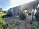 Home exterior with a stone-paver patio and a carport featuring meticulously maintained landscaping at 474 N Kristi Rd, Martinsville, IN 46151