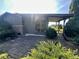 Home exterior with a stone-paver patio and a carport, featuring a brick chimney at 474 N Kristi Rd, Martinsville, IN 46151
