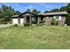 Charming home featuring a covered porch, a two-car garage and mature trees and landscaping at 474 N Kristi Rd, Martinsville, IN 46151
