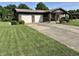 Single Gathering home featuring a two-car garage, well-maintained lawn, and a welcoming front porch at 474 N Kristi Rd, Martinsville, IN 46151