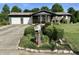 Well maintained front yard featuring mature landscaping and a view of the home's front entrance at 474 N Kristi Rd, Martinsville, IN 46151