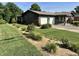 Charming single story home exterior with an attached garage, landscaped front yard, and inviting curb appeal at 474 N Kristi Rd, Martinsville, IN 46151