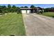 Well-manicured lawn and long driveway leading to a single story home with a two-car garage at 474 N Kristi Rd, Martinsville, IN 46151