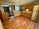Functional kitchen with matching appliances, wood cabinets, and easy-to-clean floors at 474 N Kristi Rd, Martinsville, IN 46151