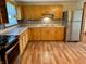 Well-lit kitchen featuring wood cabinets, modern appliances, and sleek countertops at 474 N Kristi Rd, Martinsville, IN 46151
