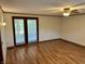 Comfortable living area featuring wood floors, access to backyard, and bright interior at 474 N Kristi Rd, Martinsville, IN 46151