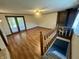 Spacious living room featuring hardwood floors, a fireplace, and access to the basement and backyard at 474 N Kristi Rd, Martinsville, IN 46151