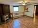 Charming living room with wood floors, fireplace and natural light from a nearby window at 474 N Kristi Rd, Martinsville, IN 46151