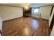 Inviting living room with wood floors, fireplace and natural light from a nearby window at 474 N Kristi Rd, Martinsville, IN 46151