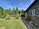 Charming side entrance with a covered walkway and verdant landscaping at 474 N Kristi Rd, Martinsville, IN 46151