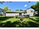 Backyard featuring a deck, patio doors, and a fire pit, perfect for outdoor entertaining at 524 Concord Ct, Fishers, IN 46038