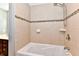 Bathroom with tiled shower featuring a showerhead and integrated soap dishes, offering convenience at 524 Concord Ct, Fishers, IN 46038