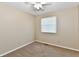 Inviting bedroom featuring neutral carpeting, a ceiling fan, and a window for ample light at 524 Concord Ct, Fishers, IN 46038