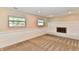 Bright and airy living room with a fireplace and large windows, creating a warm ambiance at 524 Concord Ct, Fishers, IN 46038