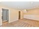 Expansive living area boasts multiple doorways, neutral walls and carpet, offering versatility at 524 Concord Ct, Fishers, IN 46038