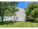Serene backyard with mature trees provides a shaded and private retreat with ample green space at 5652 Apple Branch Way, Indianapolis, IN 46237