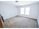 Well-lit room with carpet, a large window, and neutral walls, perfect for relaxing or working at 5652 Apple Branch Way, Indianapolis, IN 46237