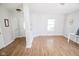 Bright living room features wood-look floors and a neutral color palette at 5652 Apple Branch Way, Indianapolis, IN 46237