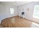 Spacious room with lots of sunlight, wood-look floors, and neutral walls at 5652 Apple Branch Way, Indianapolis, IN 46237