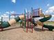 Community playground featuring dual slides, climbing structures, and monkey bars with safety ground cover at 6303 Wasco Dr, Whitestown, IN 46075