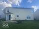Exterior of house featuring a patio and a spacious lawn at 6548 Frankenberger Dr, Indianapolis, IN 46237
