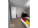 Bedroom featuring a colorful bedspread and neutral carpet at 6548 Frankenberger Dr, Indianapolis, IN 46237