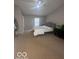 Primary bedroom featuring neutral carpet, ceiling fan, and a large window at 6548 Frankenberger Dr, Indianapolis, IN 46237