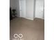 Bedroom space featuring neutral carpet and bright white doors at 6548 Frankenberger Dr, Indianapolis, IN 46237