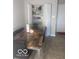 Cozy dining area with a view of a dining room table, and storage at 6548 Frankenberger Dr, Indianapolis, IN 46237