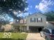 Charming two-story home with a two-car garage and a well-manicured front yard at 6548 Frankenberger Dr, Indianapolis, IN 46237