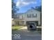 Charming two-story home with a two-car garage and a well-manicured front yard at 6548 Frankenberger Dr, Indianapolis, IN 46237