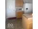 Kitchen boasting wooden cabinets, stainless steel appliances, and a cozy breakfast nook at 6548 Frankenberger Dr, Indianapolis, IN 46237