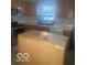 Kitchen featuring stainless steel appliances, light countertops, and a center island at 6548 Frankenberger Dr, Indianapolis, IN 46237