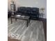 Living room featuring modern floors, a grey area rug, and comfortable seating at 6548 Frankenberger Dr, Indianapolis, IN 46237