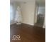 Cozy living room with hardwood floors and ample natural light at 6548 Frankenberger Dr, Indianapolis, IN 46237