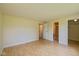 This bedroom features three doorways and light hardwood floors at 6623 Lakeknoll Dr, Indianapolis, IN 46220