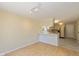 Bright kitchen with white cabinets, a breakfast bar and views into adjacent living space at 6623 Lakeknoll Dr, Indianapolis, IN 46220